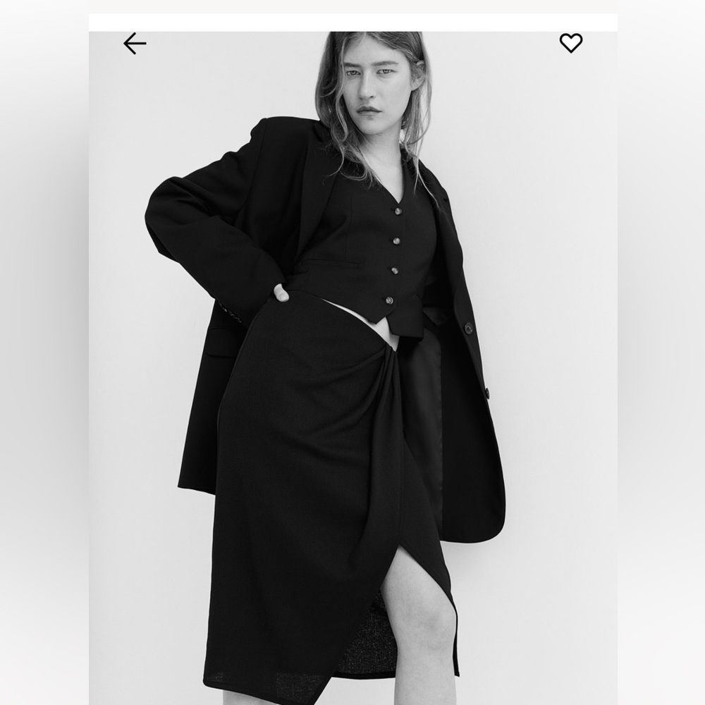 Women's black knee length skirt with front slit. Never worn.